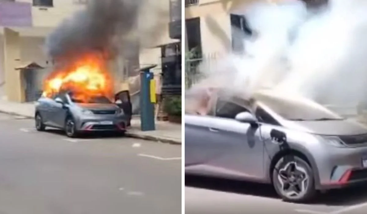 Carro el&eacute;trico da BYD com fuma&ccedil;a saindo do interior.